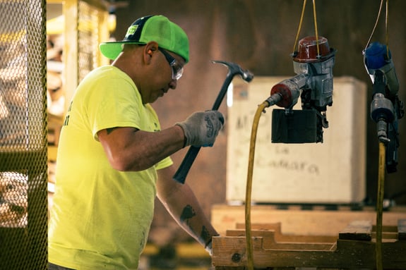 Man with a hammer providing on-site services